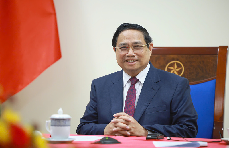 Thủ tướng Chính phủ Phạm Minh Chính điện đàm, trao đổi với Thủ tướng Algeria Sifi Ghrieb. Ảnh: VGP/Nhật Bắc